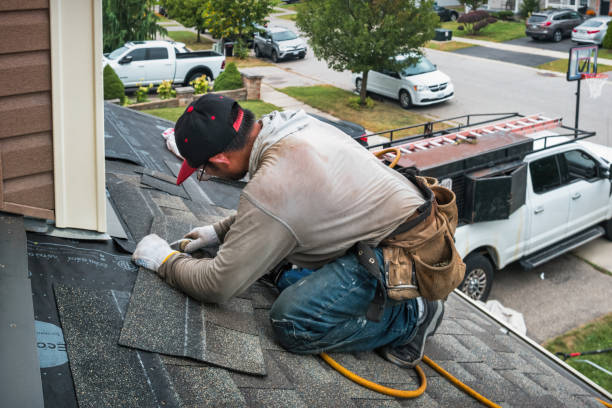 Professional Roofing technician working in Hollis, NY